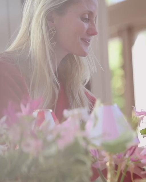 Willow Crossley Film Pink table linen with candle ware and flower arrangements